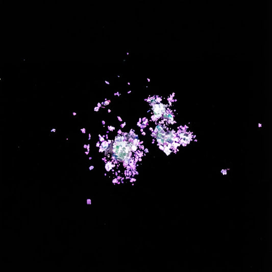 ruby magenta to amber gold flake pigment effect on black background