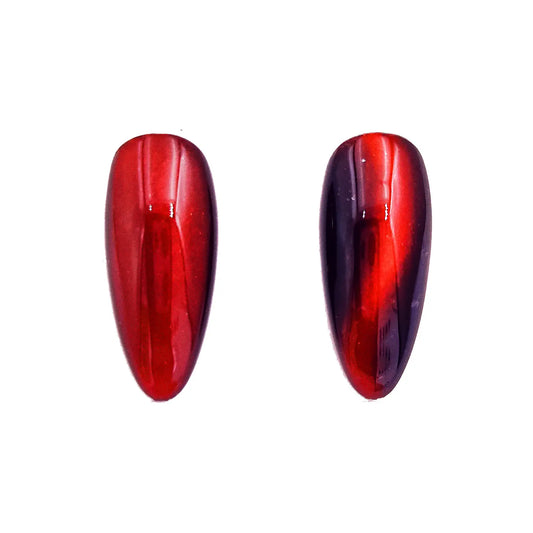 mahogany ember magnetic chrome pigment nail effect on black nail tip with visible magnetic reflective pattern