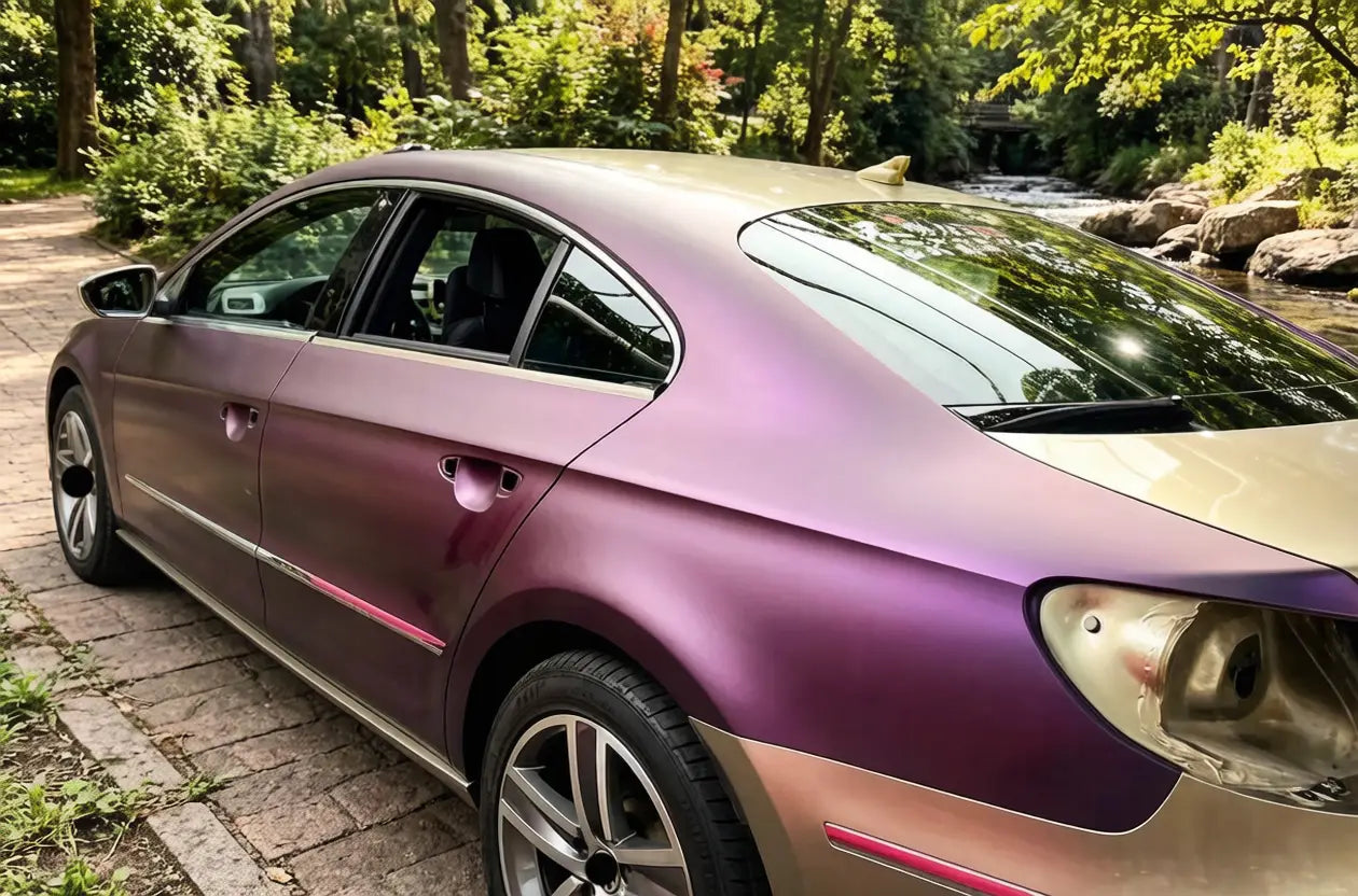 car with violet red color shifting coating parked on road